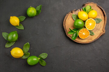 top view fresh sour lemons on dark background tree fruit citrus limes