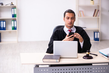 Young male lawyer working in the courthouse