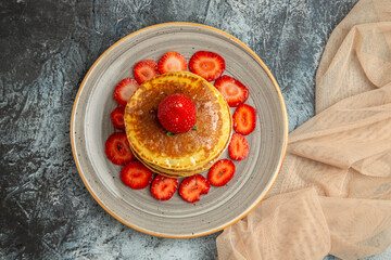 top view yummy pancakes with fresh strawberries on light background cake sweet fruit