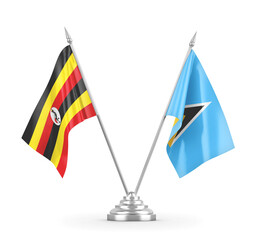 Saint Lucia and Uganda table flags isolated on white 3D rendering