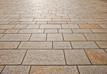 Low level perspective view of stone slab paving.