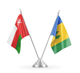 Saint Vincent and the Grenadines and Oman table flags isolated