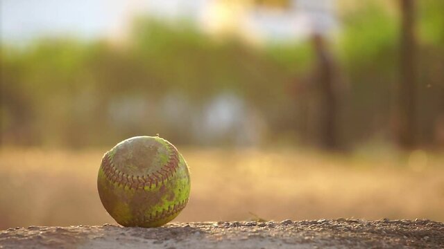 Baseball ball with the practice of a male baseball player