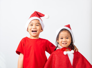 Asian little cute two brethren children boy and girl smile, Kids dressed in red Santa Claus hat...