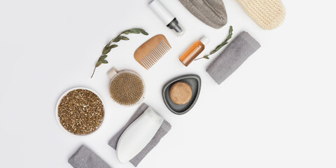 Fototapeta na wymiar Flat lay composition with bath accessories with bottles with gel or shampoo, soap, sea salt, washcloth, wooden comb