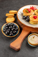 front view yummy pancakes with olives and fruits on dark background fruit sweet cake