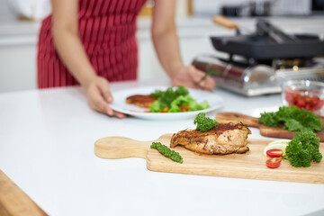 Asian housewives preparing dishes for dinner.
