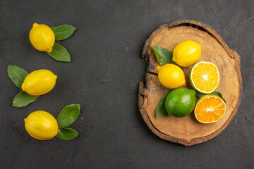 top view fresh sour lemons on dark desk lime citrus yellow fruit