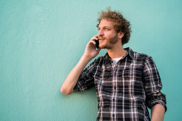 Young man talking on the phone.