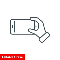 Fototapeta premium Smartphone in hand icon vector. Thin line web symbol on white background - editable stroke vector illustration eps10