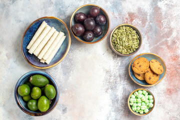 top view fresh fruits with biscuits and candies on light background sweet fresh photo cookie