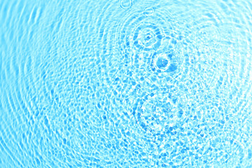 Fototapeta na wymiar texture of splashing water on pastel background