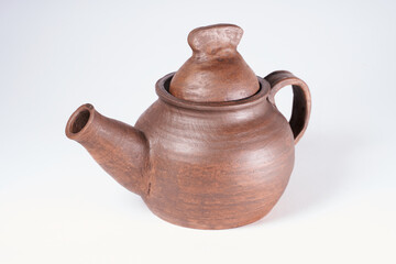 Pottery Craft, ceramic product with your own hands, made on a Potter's wheel, isolated on a white background.