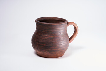 Pottery Craft, ceramic product with your own hands, made on a Potter's wheel, isolated on a white background.
