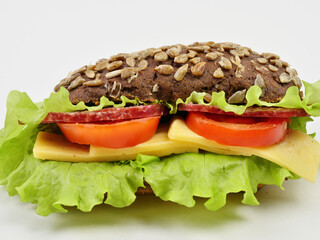 sandwich with bacon and vegetables