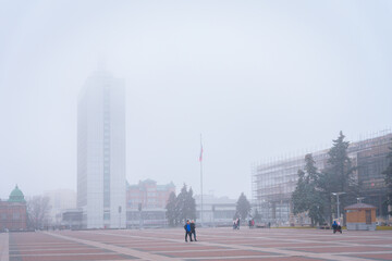 Ulyanovsk, Russia - December, 2020: The square of the 100th anniversary of Vladimir Lenin, Hotel Venets in the fog
