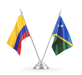 Solomon Islands and Colombia table flags isolated on white 3D rendering