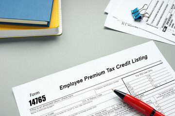 Business concept about Form 14765 Employee Premium Tax Credit Listing with inscription on the piece of paper.