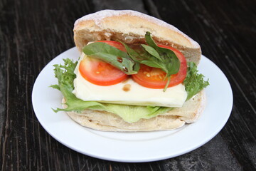 Ciabatta roll with tomato and mozzarella cheese