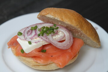 German bread roll, with smoked salmon, cream cheese and onions