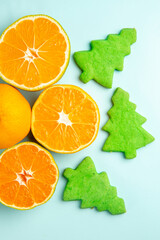 top view fresh tangerine slices on light-blue background orange photo citrus