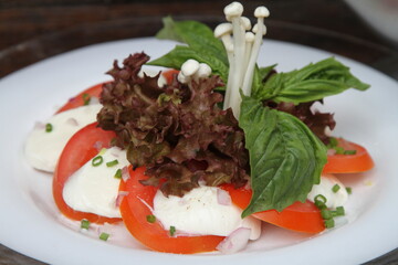 Tomato mozzarella with greens