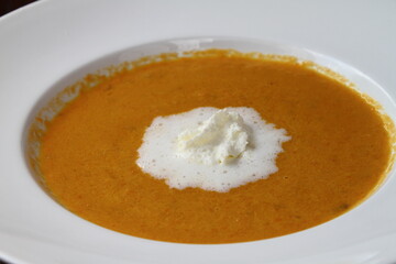 Carrot soup with whipped cream