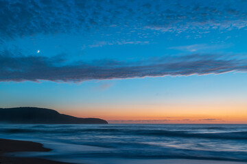 High cloud, partial moon and a pretty blue dawn at the beach