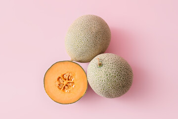 Sweet ripe melons on color background