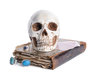Spell book, human skull and cards on white background