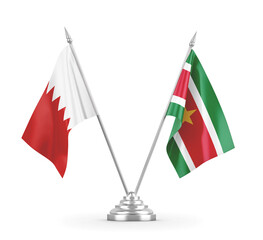 Suriname and Bahrain table flags isolated on white 3D rendering 