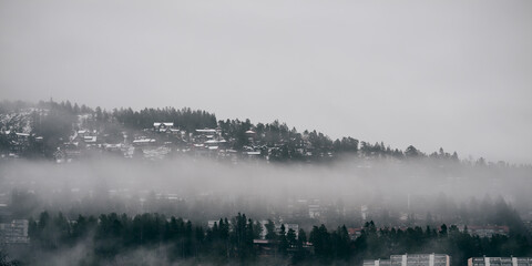 Holmenkollen in Dececmber. Fog and rain is the main weather in Oslo in December 2020.