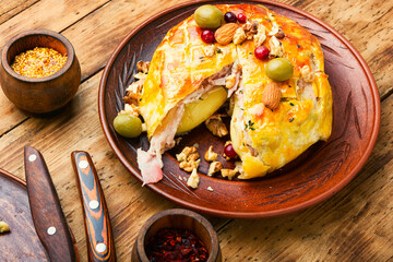 Camembert cheese baked in bacon