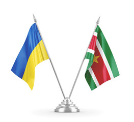 Suriname and Ukraine table flags isolated on white 3D rendering