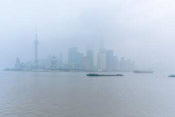 Fototapeta premium The bund in Shanghai, on a thick foggy day.
