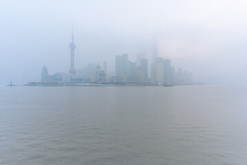 Fototapeta premium The bund in Shanghai, on a thick foggy day.