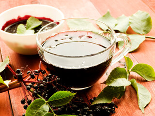 Elderberry drink on wood