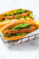 Vegan carrot hot dog with salad and avocado. Alternative fast food. Healthy food concept.