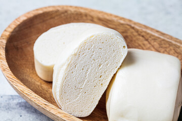 Chinese steamed rice roll bun on wooden plate. Chinese food concept.