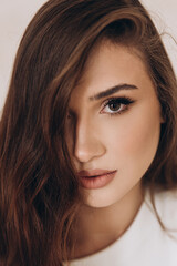 Obraz premium Beautiful girl in a dress on a fashion photoshoot in a photostudio