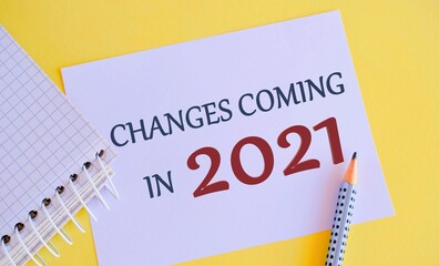 Changes Coming in 2021 written on white paper. Text sign showing Changes Is Coming. Conceptual photo telling someone that future going to be different.