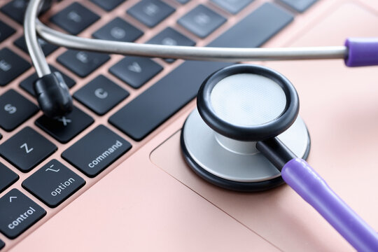 Stethoscope on laptop keyboard. Medical continuing education courses