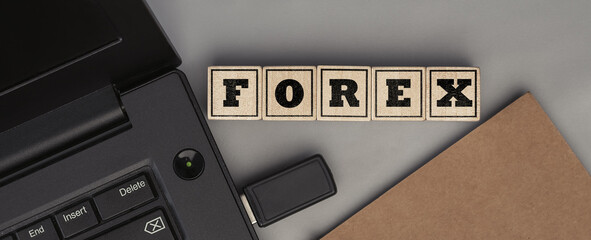 The word FOREX made from wooden cubes. Top view