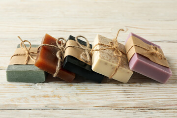 Pieces of natural handmade soap on wooden background - obrazy, fototapety, plakaty