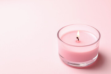 Scented candle for relax on pink background