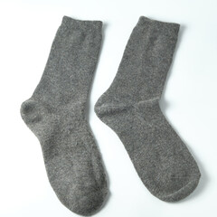 Pair of blank grey wool socks isolated on white