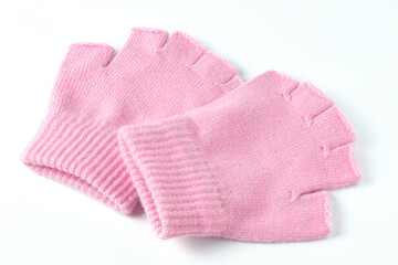 Pink colored winter mittens isolated on white