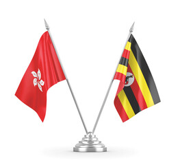 Uganda and Hong Kong table flags isolated on white 3D rendering