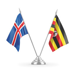 Uganda and Iceland table flags isolated on white 3D rendering