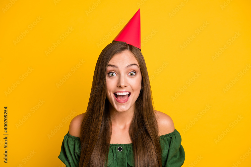 Sticker close-up portrait of lovely amazed cheerful brown-haired girl festal occasion wearing paper cap isol